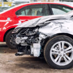 Cars in a Nissan auto body shop
