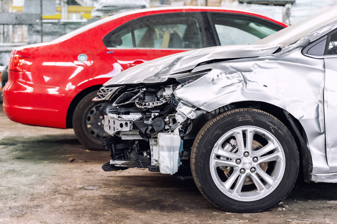 Cars in a Nissan auto body shop